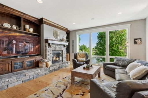 Living room with stone hearth and knotty alder built-ins
