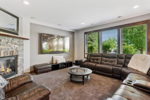 Lower level family room with stone gas fireplace