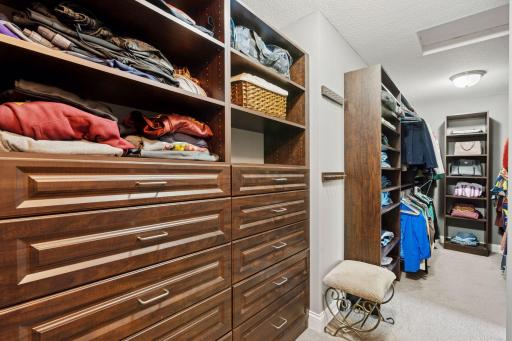 Massive his/hers closet with custom shelving