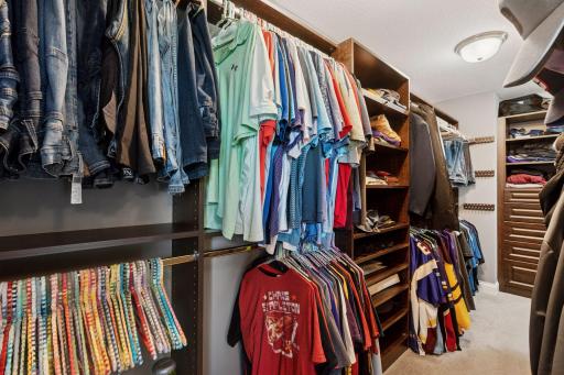 Massive his/hers closet with custom shelving