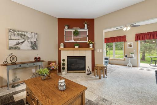 Gas fireplace with tile surround in living room