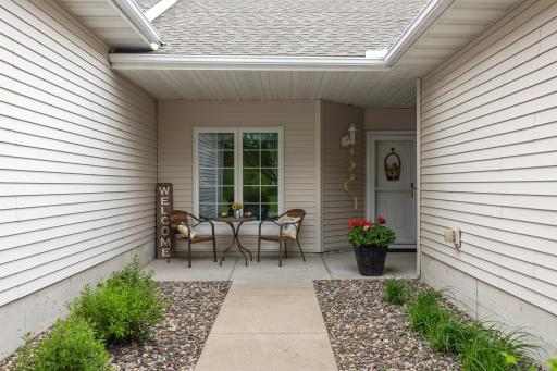 Front private garden area with covered patio. Great for a morning coffee or a nightcap outside