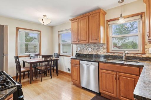 Updated kitchen with granite, stainless appliance and eating area.