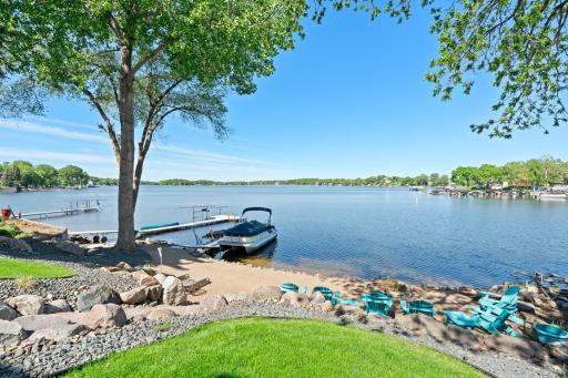 Gorgeous lake views & spacious sandy beach just steps from your back door!
