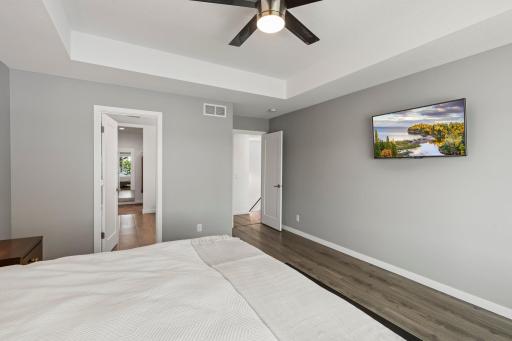 Primary bedroom leads to ensuite bath & walk-in closet