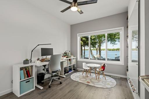 A flexible main-floor bedroom serves beautifully as a workspace, playroom, or quiet retreat