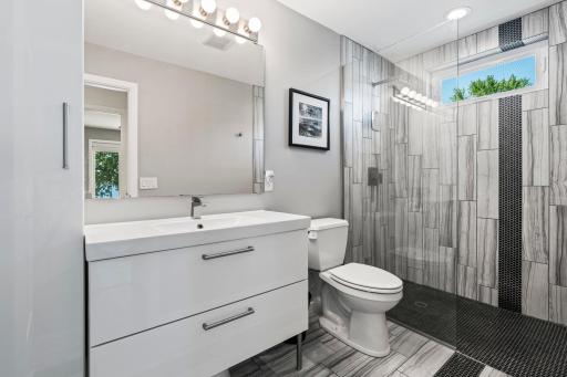 Stylish upper level 3/4 bathroom with tile walk-in shower