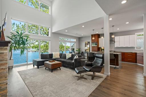 Soaring ceilings and panoramic windows flood the space with natural light and views