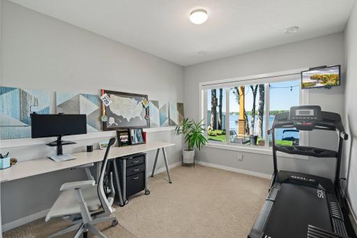 Bedroom on the lower level offers versatile spaceâideal for a home office, gym, or flex room to suit your needs