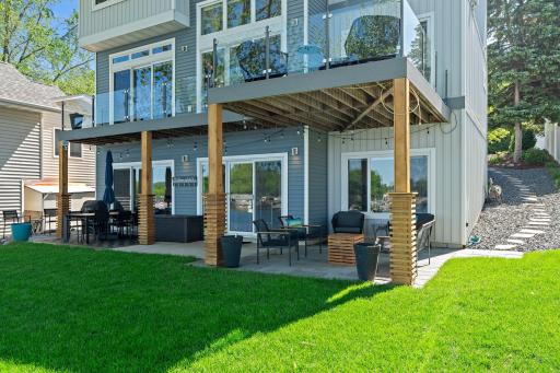 The covered patio provides shade on hot summer days and a cozy spot for relaxing or dining