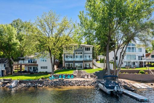 Enjoy the lake life with your own private sandy beach just steps from the back door