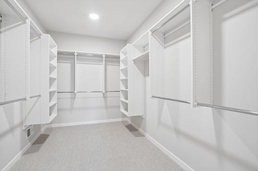 Expansive walk-in closet perfect for organizing wardrobes and seasonal items.