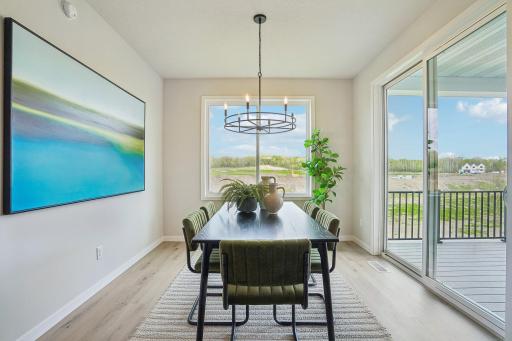 The informal dining room steps right out to the low maintenance deck. Great for the summer grilling!
