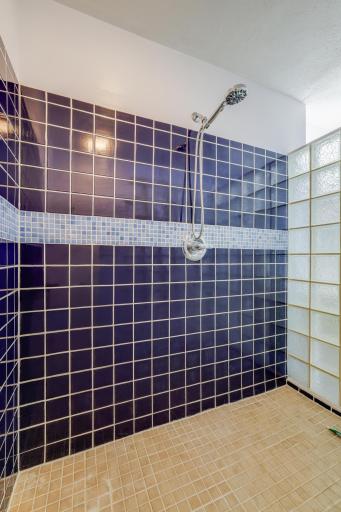 The primary shower is completely tiled and boasts tons of space!