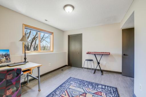 The third bedroom is currently being used as an office space.