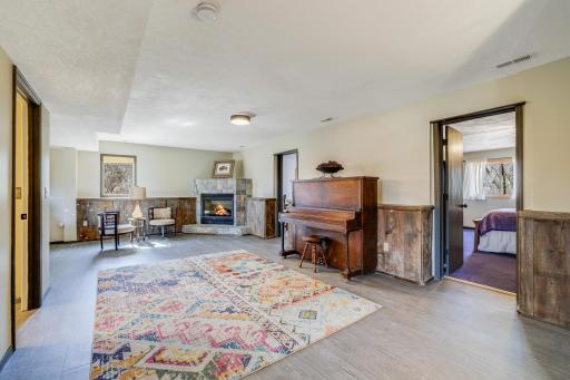 The spacious lower-level is designed with versatile family and living room areas, a charming gas fireplace, a Â¾ bathroom, and 3 additional bedrooms, as well as entry to the 3-car garage.