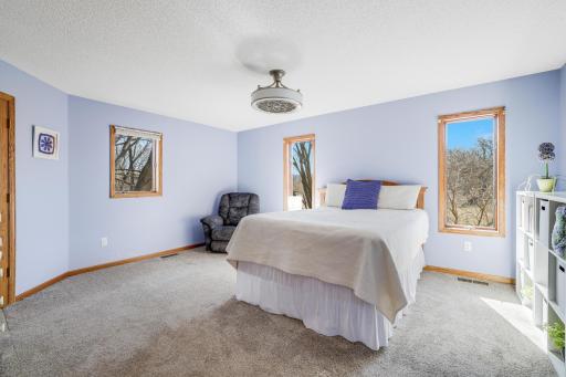 A huge space with a natural light pouring in and a phenomenal view of the acreage this property resides on.