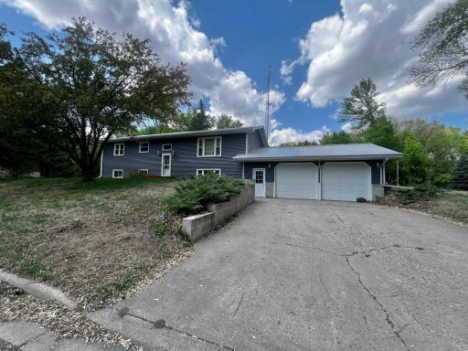 Front of the Home - Two Car Garage, Steel Roof, New Vinyl Siding, Newer windows and Storm Door!