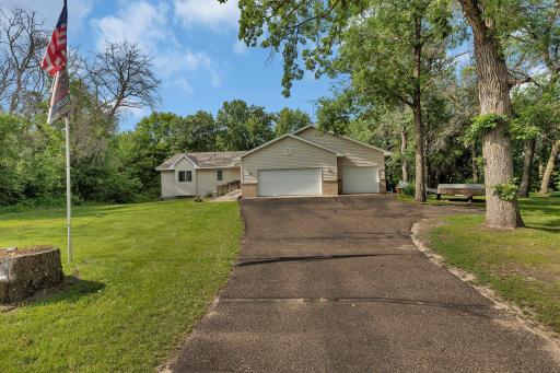 Welcome to this beautifully maintained rambler-style home, perfectly nestled on a scenic, tree-lined lot that offers the best of privacy and nature.