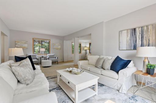 As you descend from the upper level into the main living room, youâre greeted by an abundance of windows on both sides of the home, flooding the space with natural light year-round.