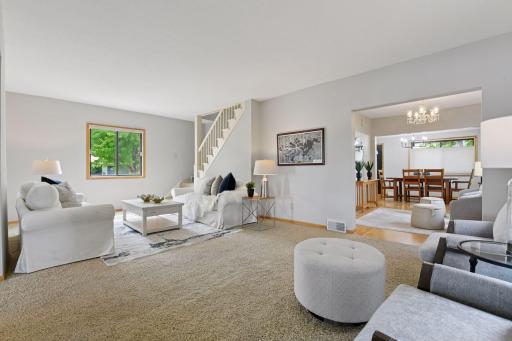 Corner view showcasing the upper level staircase, along the adjacent flex space, highlighting the homeâs open and inviting layout.