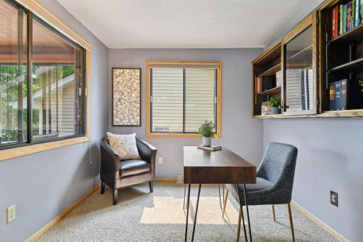 Sun filled main level office with a view to work from home and watch the boats drift by on Lake Minnetonka.