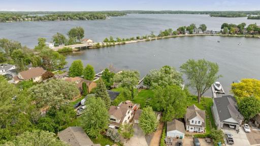 Aerial view of home with gorgeous backyard experience with gradual slope to water which is ideal for all to enjoy this property.
