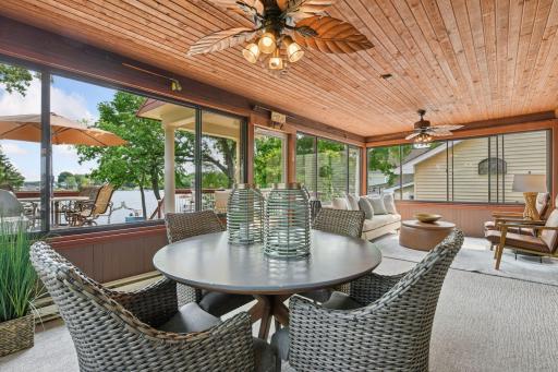 The three season screened-in porch w/heat and windows on the lakeside of the home extends your living spaceâideal for dining, lounging, or enjoying lakeside evenings.