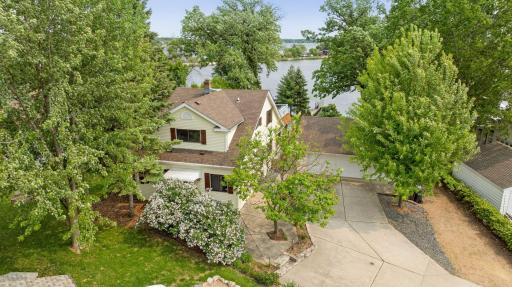 Nestled in on .39 acre with South facing and West facing to capture sunsets views on Lake Minnetonka