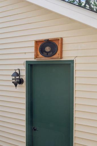 Welcome to "The Easy" â the garage entry thoughtfully designed with a cozy pub area inside, where the seller has shared countless stories and enjoyed a beverage, creating a warm gathering spot for guests of all ages.