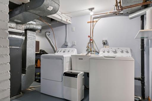 The lower level has been thoughtfully renovated by the sellers, featuring a spacious utility and laundry room complete w/ ample storage, a wall closet, and a washer/dryer area perfectly designed to handle towels and wet swimsuits after a day on Lake.