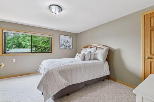 Spacious second upper-level bedroom (16.5x12.5) features a generous walk-in closet and offers plenty of room to comfortably accommodate an additional bedâideal for hosting guests or extended family.