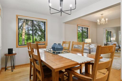 Bright and inviting, the informal dining area offers seamless views into the flex space and ML living room. Framed by expansive windows, this sunlit space captures the beauty tranquility of the lake, creating a perfect setting to dine and unwind.