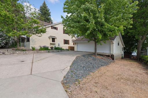 This lake home offers a 3 car heated garage with a private side drive leading to a beautifully landscaped backyard. Ideal access to your backyard when doing landscaping, working on projects, or maybe want to add sand to your lake front!