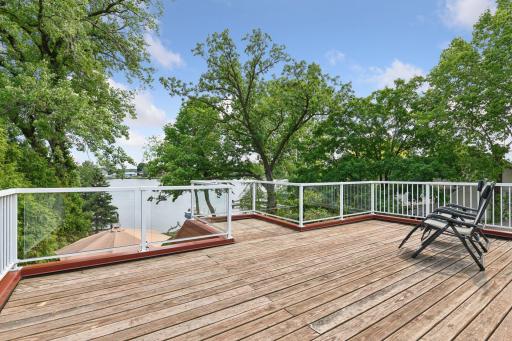 Directly off the primary bedroom, the expansive 23x17 upper balcony is one of the best spots in the home for sun lovers. Perfect for sunbathing, relaxing, or simply enjoying the outdoors with sweeping views of Lake Minnetonka.