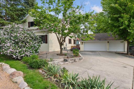 The home is beautifully surrounded by lush landscaping on all sides, creating your own private oasis nestled on the shores of Lake Minnetonka.