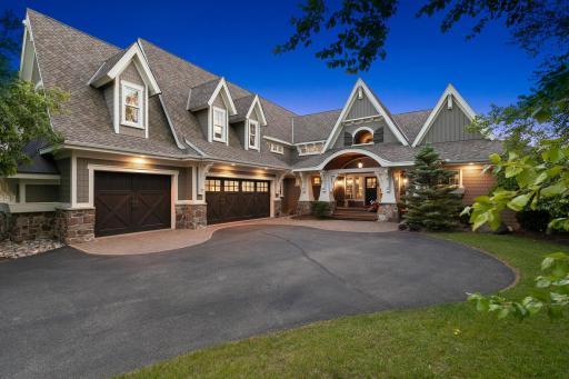 Custom built by TC Home Builders. Amazing curb appeal! Home is set away from the road and boasts paver accents at the top of the drive, stacked stone & copper accents, and a roofline featuring dramatic pitches & dormers.