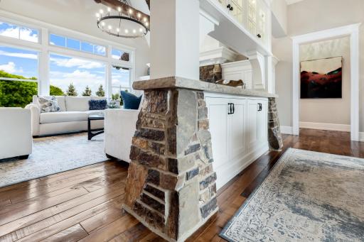 Large wall-of-windows include a picture window, side windows and multiple upper transoms (one is located high up within the vault) for stunning backyard views & incredible natural light.