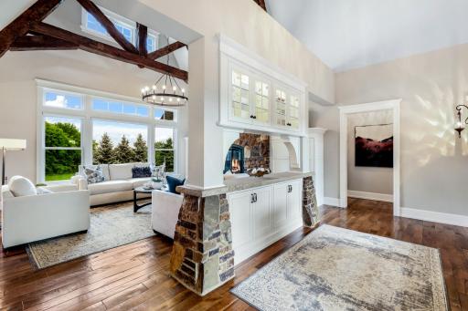 2 story vault & views of main level gathering areas (kitchen, dining & great room).