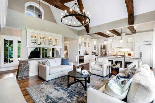 2-story vault highlighted with reclaimed hand-hewn timber beams.