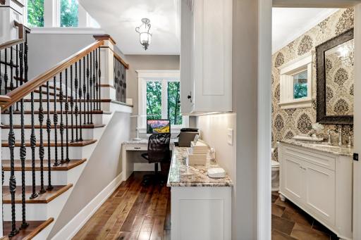 Office niche off the kitchen â L-shaped granite workspace, enameled built-ins/storage & under cabinet lighting.