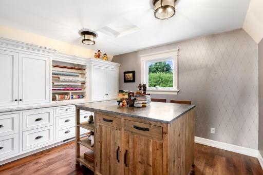 Designed for wrapping and crafts with custom, enameled built-ins, but could easily serve as a fantastic home office as well. The wrapping table can be removed.