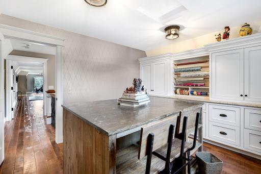 Designed for wrapping and crafts with custom, enameled built-ins, but could easily serve as a fantastic home office as well. The wrapping table can be removed.