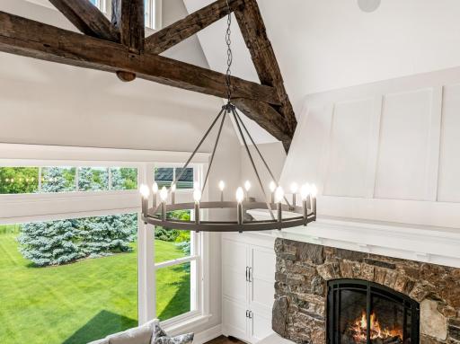 Updated wagon wheel lighting lights this beautiful space.