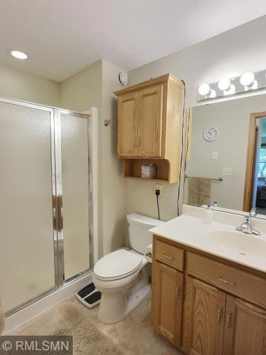 The private three-quarter primary bedroom is an ideal space. A spacious walk-in closet completes the main level primary suite.