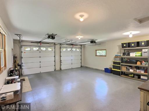 This finished double attached garage offers a clean and polished epoxy floor, making it both durable and easy to maintain.