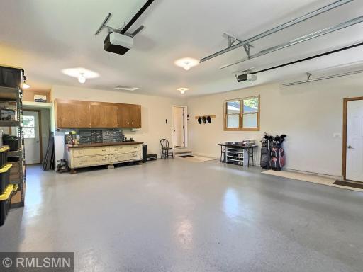 The garage offers light from multiple windows, and ample space for vehicles, tools, or storage, itâs the ideal setup for any hobbyist or homeowner.