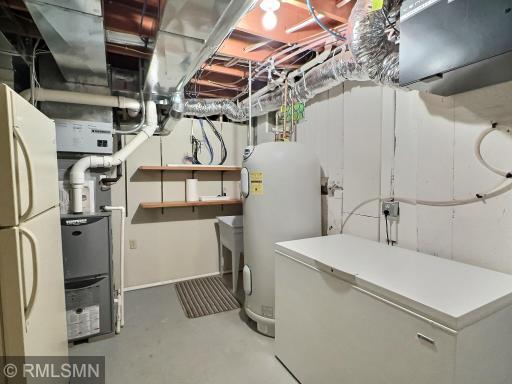 The utility room offers an enormous amount of space, of to the right (not pictured) is an ample amount of storage space...stay organized!