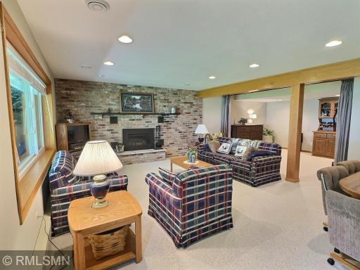 The walkout lower-level family room offers comfortable lakeside living with scenic views and direct access to the backyard and patio.