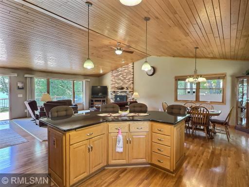 Sliding glass doors lead to the deck, seamlessly blending indoor comfort with outdoor beautyâperfect for entertaining or simply relaxing by the lake.